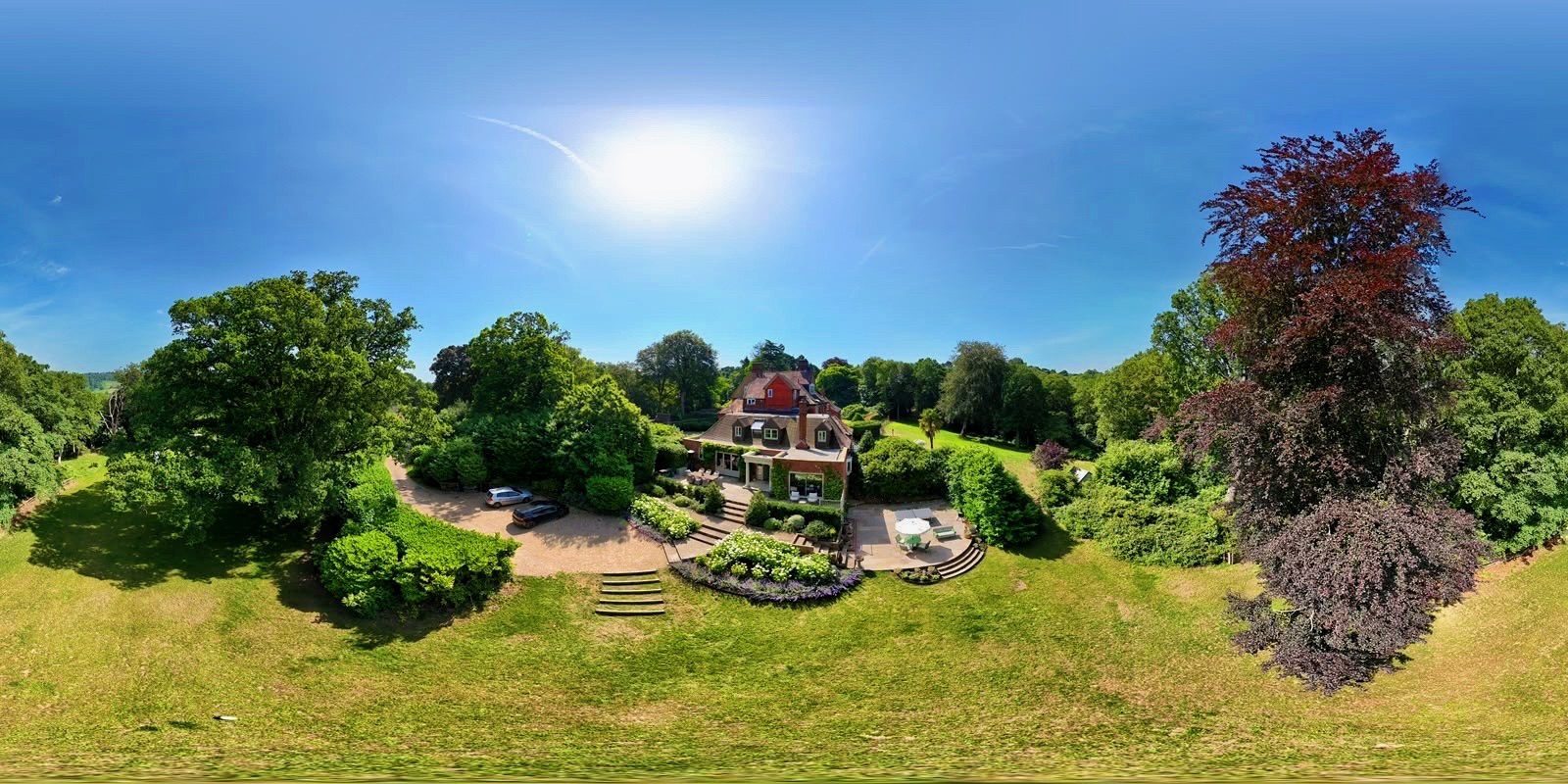 Country estate centred within a broad landscaped lawn and mature trees